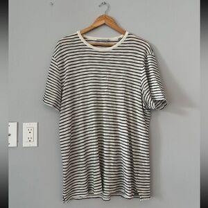 Men’s Vince black and white striped T-shirt in size medium.